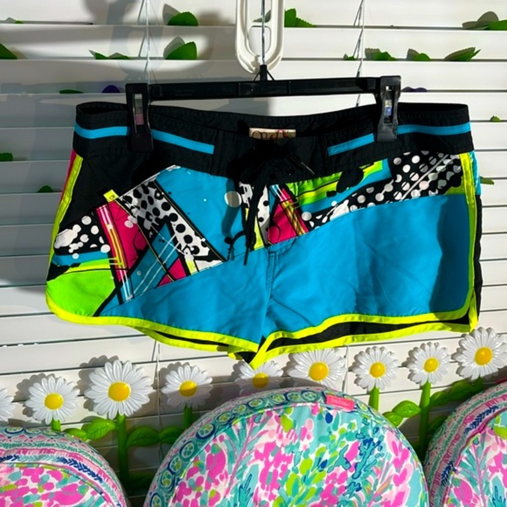 Op multicolored neon on black short board shorts
